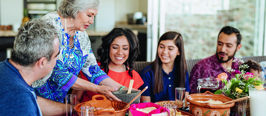 Latin American family having family lunch together in summer stock photo